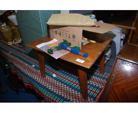 A small table and some tapestry pieces.