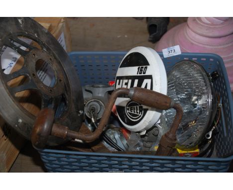 A brake disc, Hella spot lamp, brace, tyre levers, etc.