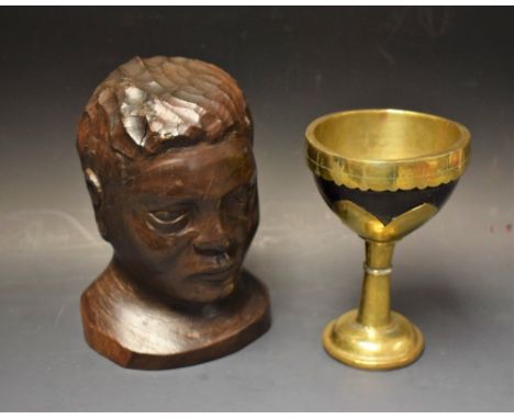 A coconut husk and brass mounted goblet;  a carved bust of a tribesman, signed R. P. Simpson '91 (2)