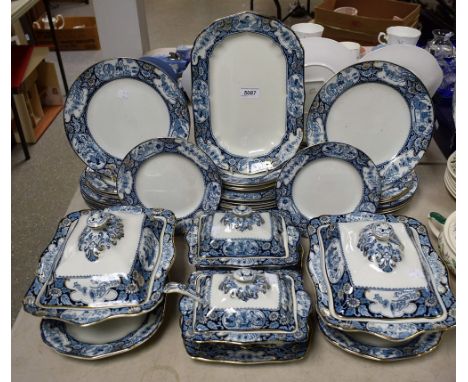 A Booth's Buddha pattern dinner service, transfer printed in blue and white with figures in oriental garden landscapes, compr