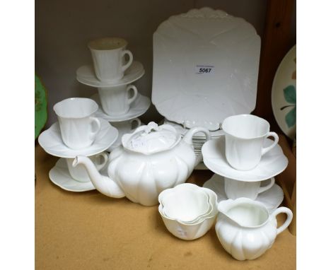Ceramics - a Shelley Dainty White tea service to include seven cups and saucers, eleven side plates, two bread and butter pla