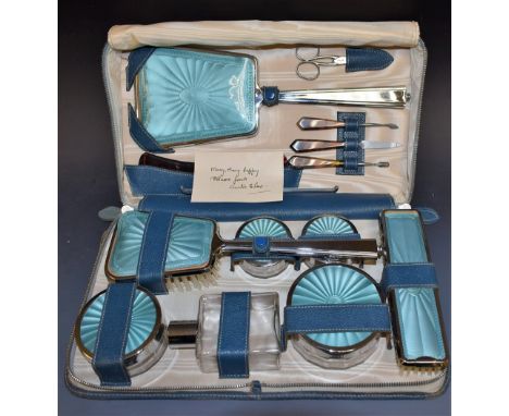 A lady's travelling  dressing table set in chrome and faux blue enamel, comprising clothes brush, hair brush, four various po