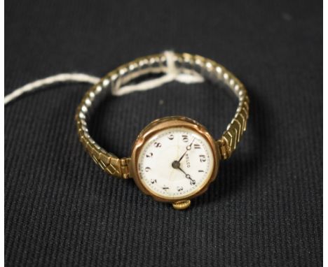 Rolex - a vintage Rolco 9ct lady's wrist watch, white enamel dial, Arabic numerals, blued hands, minute track, shaped circula