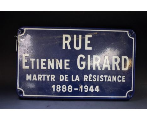 A French enamel road sign, RUE ETIENNE GIRARD MARTYR DE LA RESISTANCE 1888 - 1944