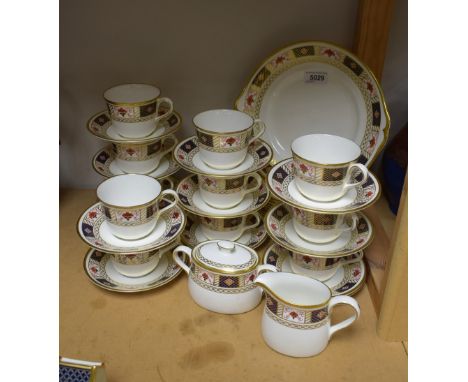 A Royal Crown Derby Border pattern tea set, comprising eleven teacups, twelve saucers, twelve tea plates, bread and butter pl