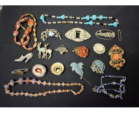 An Art Deco metamorphic clip/brooch, set with faceted clear glass stones; a Jomaz brooch as a apir of deer; glass bead neckla