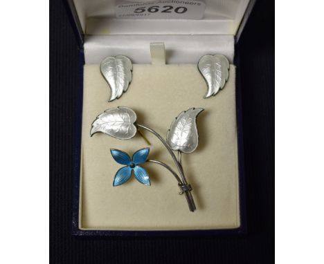 Ivar T Holth - a Norwegian silver and enamel flower brooch and conforming leaf earrings suite, pale blue four petal flower he