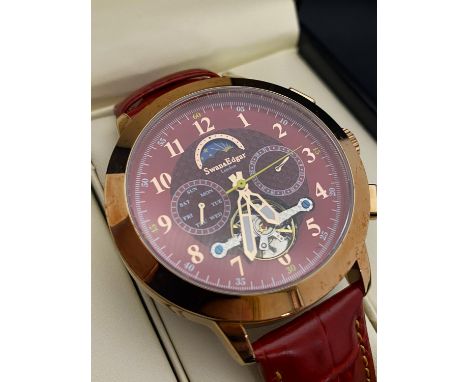 A boxed as new Swan and Edgar automatic chronograph watch with moonphase and open heart dial
