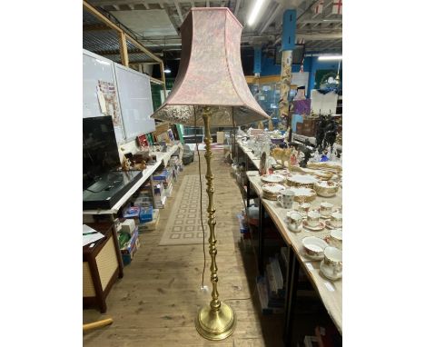 A brass floor lamp with shade, shipping unavailable