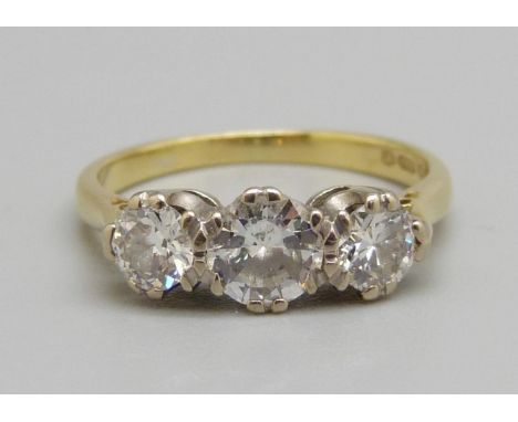 An 18ct gold, three stone diamond ring, centre stone approximately 0.5ct weight, 3.1g, L 