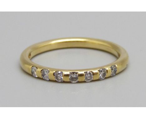 An 18ct gold seven stone diamond ring, 3.4g, O 