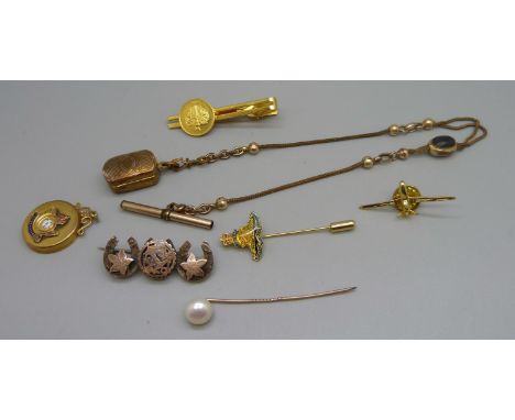 A plated Albert chain with plated vinaigrette, a K.O. Yorkshire L.I. pendant with enamel detail, a Victorian silver horseshoe