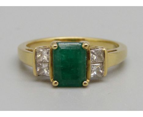 An 18ct gold, emerald and diamond ring, 0.26ct diamond weight marked on the shank, 3.5g, K 