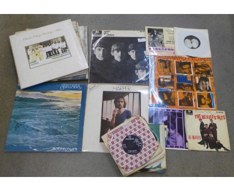 A collection of records including The Beatles, Jimi Hendrix, Bob Dylan, etc. 