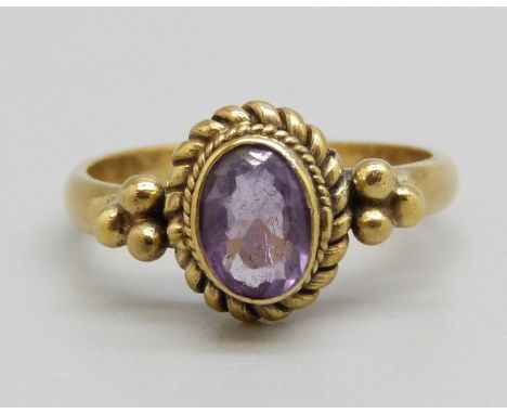 A silver gilt and amethyst solitaire ring, P 