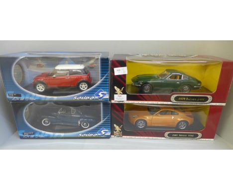 Two Solido 1:18 scale, and two Road Signature model cars, boxed 