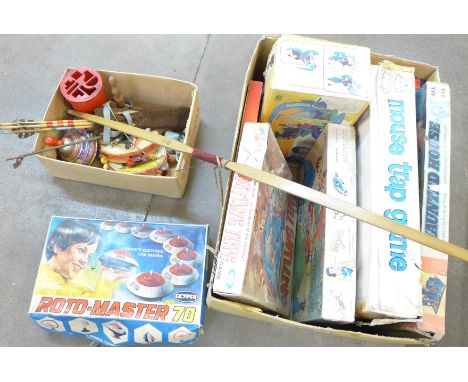 Two boxes of children's toys and games including Battling Tops, Monopoly, Roto Master, Chad Valley slide projector, Mouse Tra