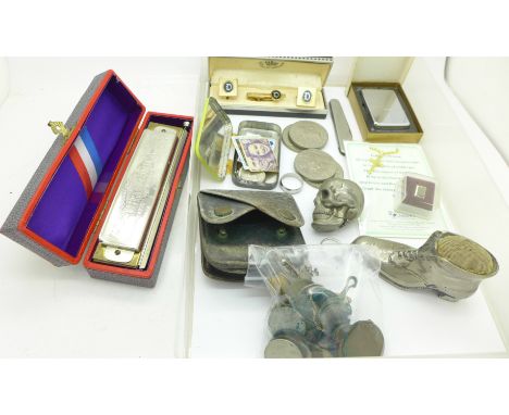 A Hohner Super Chromonica harmonica, a Zippo lighter in original box, a boot pin cushion, skull vesta case and coins, etc.