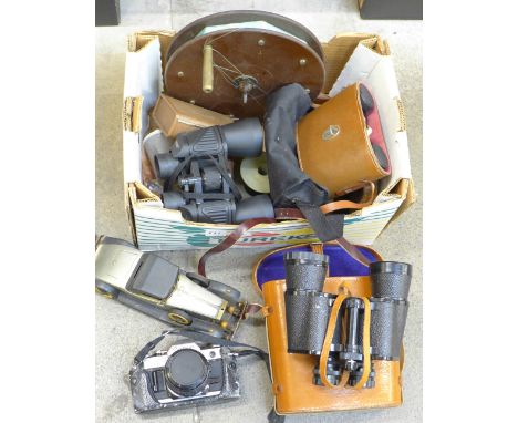 Three pairs of binoculars, a Bakelite sea fishing reel, fish hooks, line, vintage motor car and a Canon AE-1 35mm film camera