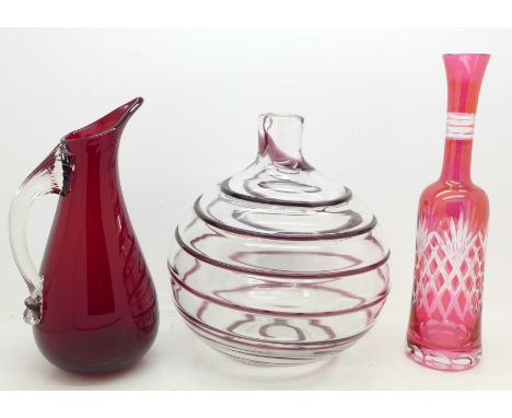 A Whitefriars glass jug and a ribbon trailed vase by Barnaby Powell and a flash cut ruby bottle vase
