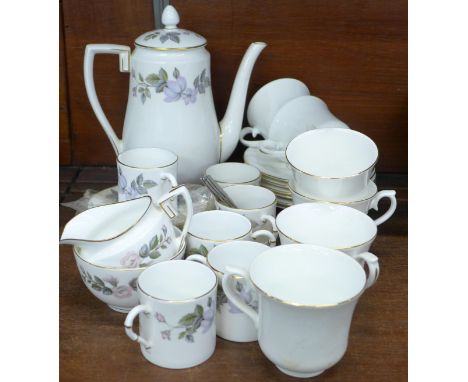 A Royal Worcester six setting coffee service, June Garland pattern, and six Queen Anne cups and saucers