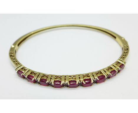 A 925 silver gilt stone set bangle