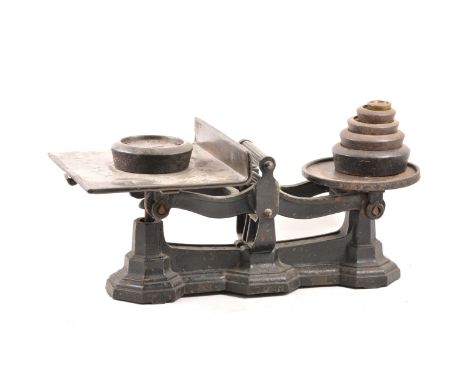 Set of cast iron scales with weights.