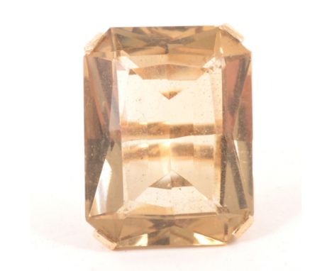 A large smoky quartz dress ring, the rectangular step cut stone, 25mm x 20mm four claw set in a 9 carat yellow gold mount hal