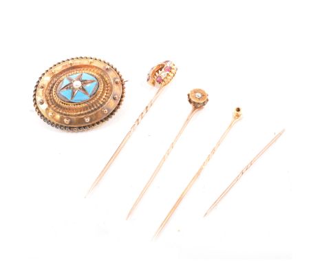 A ruby and diamond horseshoe stick pin, set with five rubies and four old cut diamonds, a small diamond stick pin star gypsy 