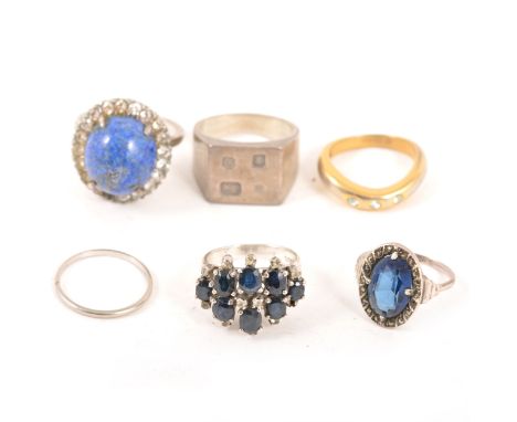 Six silver and platinum rings, a hallmark signet ring London 1978, ring size P, marcasite and blue stone ring, a 1.4mm wide b