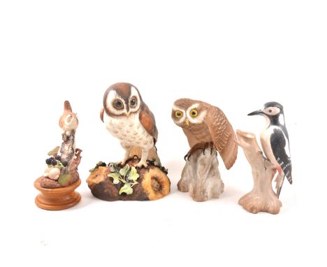 Royal Crown Derby model of a Brown Owl, 26cm; Spode model of a Little Owl; Spode Greater Spotted Woodpecker; and a Roberts mo