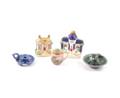 A Staffordshire cottage money box, 12cm, a Staffordshire cottage pastille burner, 16cm, two Branham chamber sticks, one plain