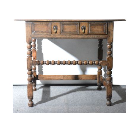 Joined oak side table, 18th Century, rectangular boarded top with moulded edge, frieze drawer with applied moulding, bobbin t