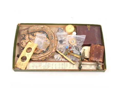 A tray of collectables, napkin clip, buttons, photo frame, small purse, compass.