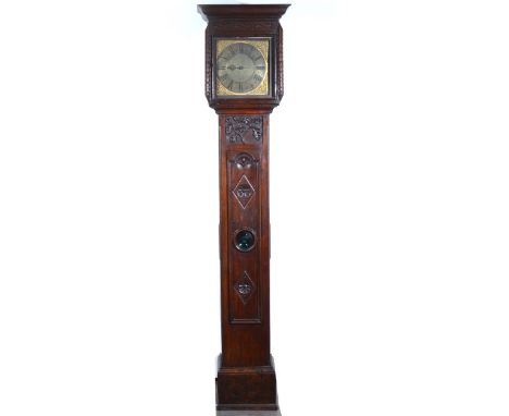 Oak longcase clock, narrow case, cornice, long door with bullseye glass, plinth base, later carved, 11" square brass dial wit