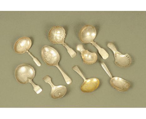 Ten George III and later silver caddy spoons by John Thropp or Joseph Taylor, displaying different patterns and styles, all h