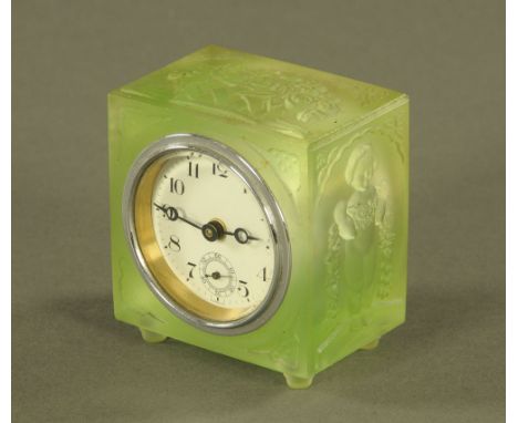 A 1930's green frosted relief moulded glass desk clock.  Width 7 cm. CONDITION REPORT: This clock appears to be in good overa