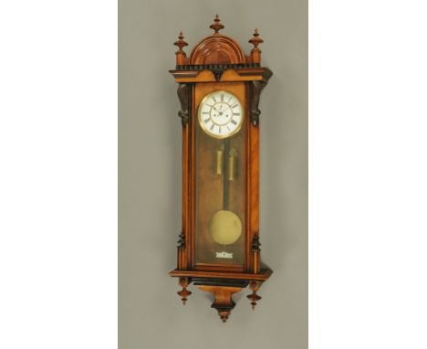 A late 19th century walnut Vienna regulator wall clock in the manner of Gustav Becker, with two train weight driven movement 