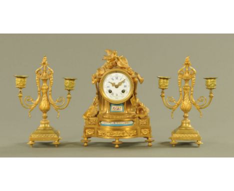 A 19th century ormolu and porcelain clock, with two train striking movement and enamelled dial with Roman numerals and subsid