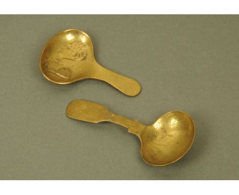 An early 19th century brass caddy spoon, the oval bowl cast in relief with profile of The Duke of Wellington and one other br