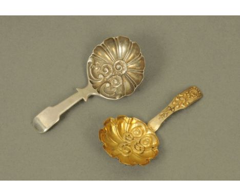 A George IV silver gilt caddy spoon by Samuel Pemberton, with circular leaf scroll embossed bowl, Birmingham 1822, together w