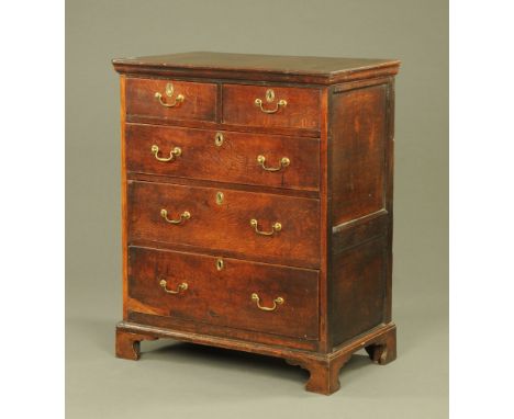 A George III oak chest of two short and three long drawers, raised on bracket feet.  Height 115 cm, width 94 cm, depth 59 cm.