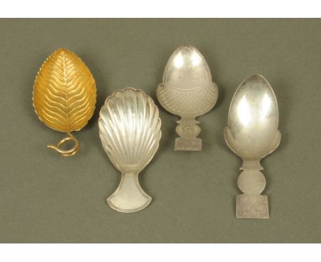 Four George III silver caddy spoons by Elizabeth Morley, displaying different patterns and styles including silver gilt leaf 