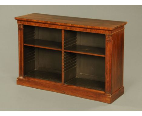 A George IV rosewood low open front bookcase, the rectangular top above a plain frieze and adjustable shelving between hinged