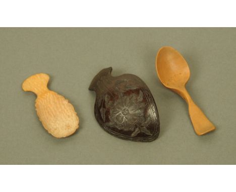 An early 19th century carved boxwood caddy or teaspoon, possibly Welsh and two other wooden caddy spoons.
