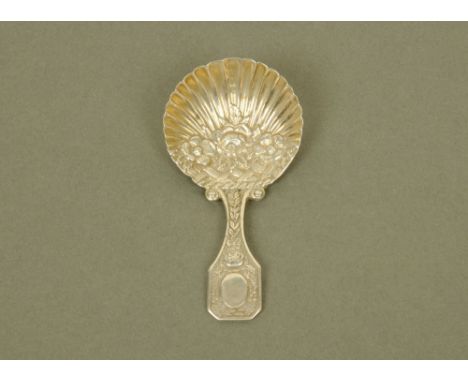 A George III silver caddy spoon by Matthew Linwood, cast and embossed in relief with floral motifs and with scalloped bowl, B