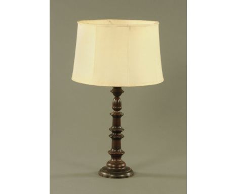 A 20th century turned wooden table lamp, 45 cm.   CONDITION REPORT: Staining to the shade and some marks, scratches and minor