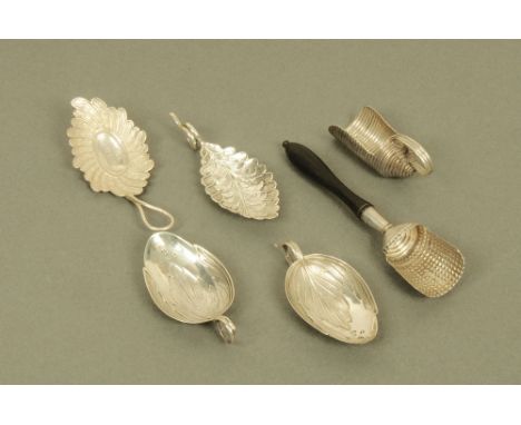 A group of six George III silver caddy spoons by unidentifiable Birmingham maker W, comprising pair of leaf capped spoons, tw