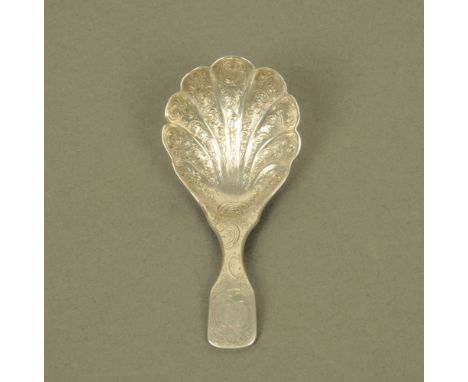 An early Victorian silver fiddle pattern caddy spoon by W E, possibly William Eaton, engraved throughout with leaf scrolls an