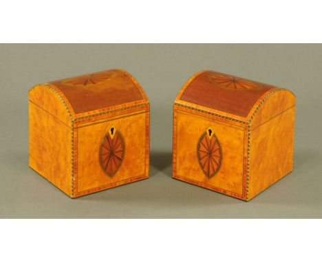 A pair of George III mahogany and amboyna domed top square section tea caddies, inlaid with shell paterae, satinwood bandings